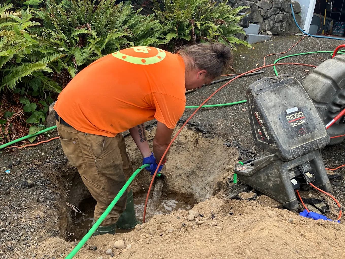 Seattle Select Sewers technician performing sewer line repair